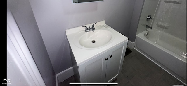 bathroom featuring vanity and washtub / shower combination