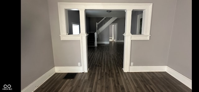 hallway featuring dark wood-type flooring