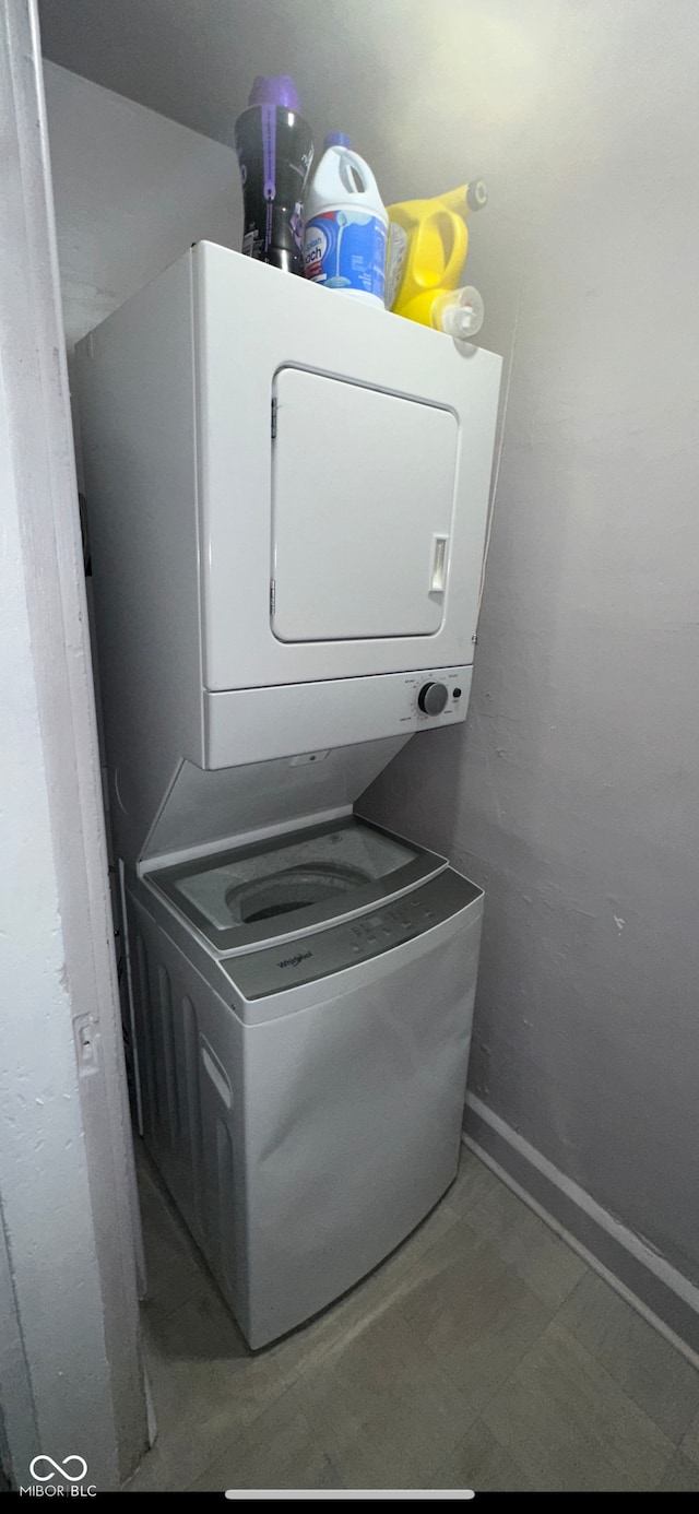 washroom with stacked washer / drying machine