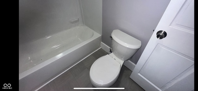 bathroom with tile patterned floors and toilet