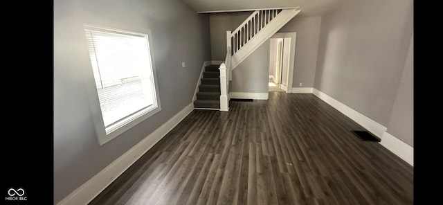 interior space featuring dark hardwood / wood-style flooring and plenty of natural light