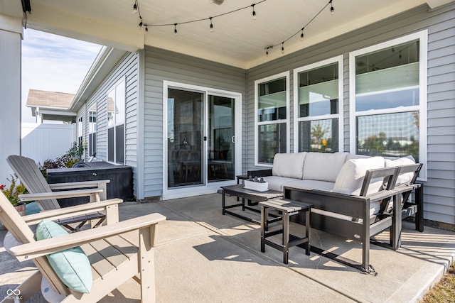 view of patio with a hot tub and outdoor lounge area