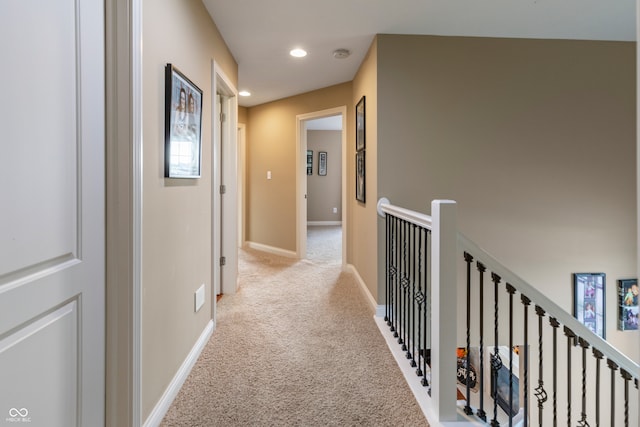 hallway with light colored carpet