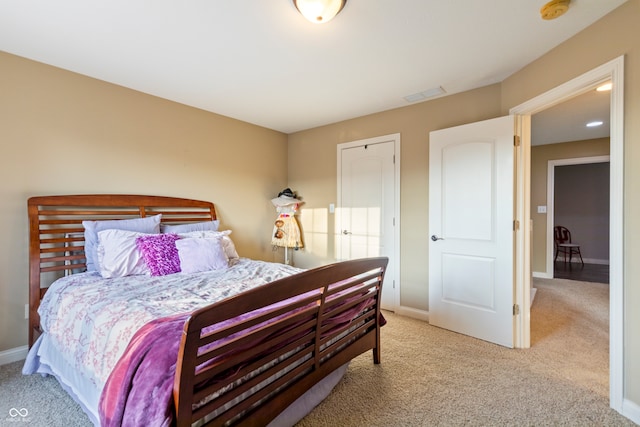 bedroom with light colored carpet