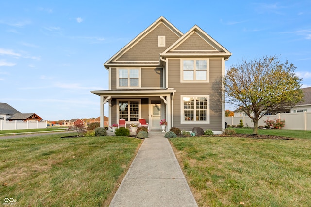 view of front of property featuring a front yard and a porch