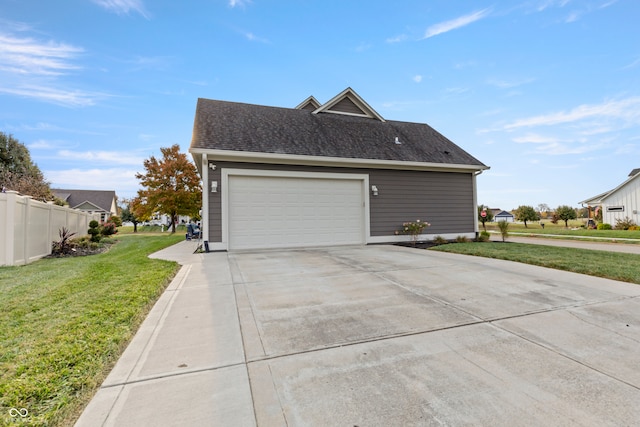 view of property exterior with a garage and a yard