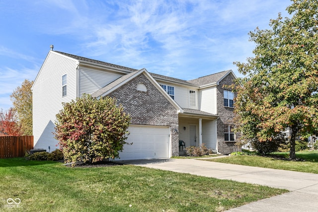 view of front of home featuring a front yard and a garage