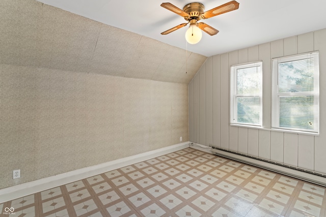 bonus room featuring ceiling fan, vaulted ceiling, and a baseboard heating unit