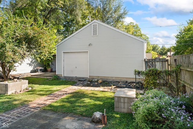 garage featuring a lawn