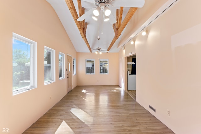 spare room with high vaulted ceiling, light wood-type flooring, ceiling fan, and beamed ceiling