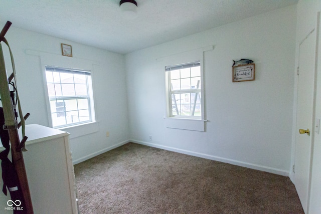 interior space with a healthy amount of sunlight and a textured ceiling