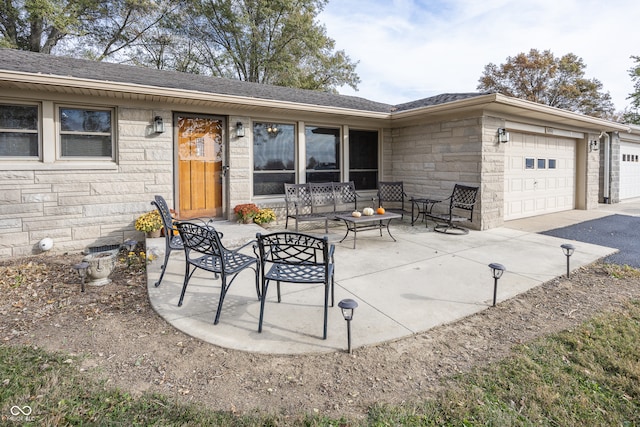 view of patio / terrace with a garage