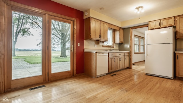 5861 S 100 W, Fountaintown, IN 46130 - kitchen with white appliances, light wood-type flooring, light countertops, and plenty of natural light