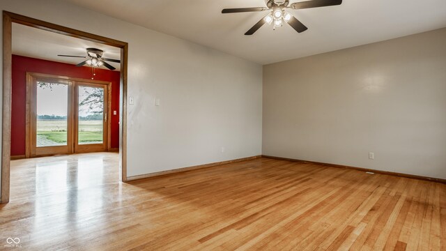 5861 S 100 W, Fountaintown, IN 46130 - unfurnished room with a ceiling fan, light wood-style floors, and baseboards