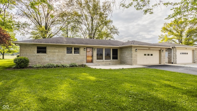 5861 S 100 W, Fountaintown, IN 46130 - ranch-style home with stone siding, an attached garage, driveway, and a front lawn