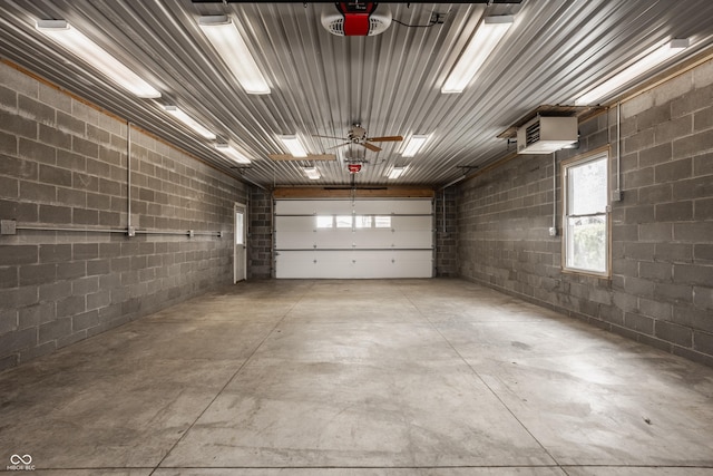 5861 S 100 W, Fountaintown, IN 46130 - garage featuring concrete block wall and a garage door opener