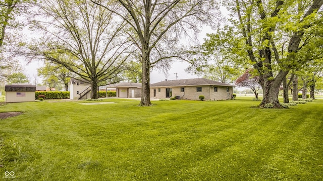 5861 S 100 W, Fountaintown, IN 46130 - view of green lawn with a shed and an outdoor structure