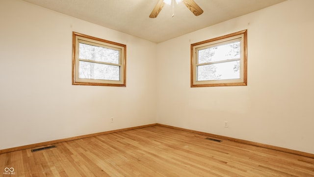 5861 S 100 W, Fountaintown, IN 46130 - empty room featuring light wood-style floors, baseboards, and a ceiling fan