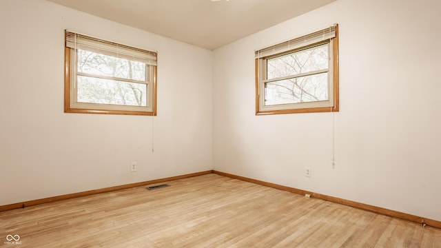 5861 S 100 W, Fountaintown, IN 46130 - spare room featuring plenty of natural light, baseboards, and light wood-type flooring