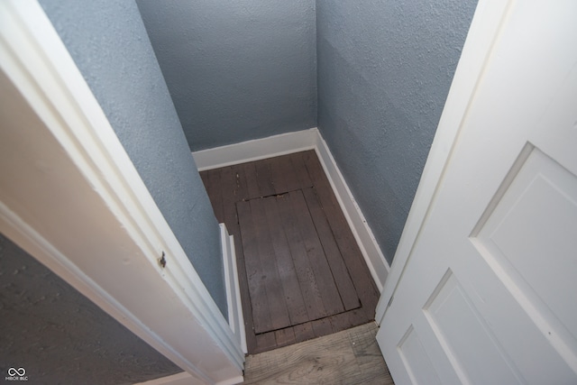 stairs with wood-type flooring