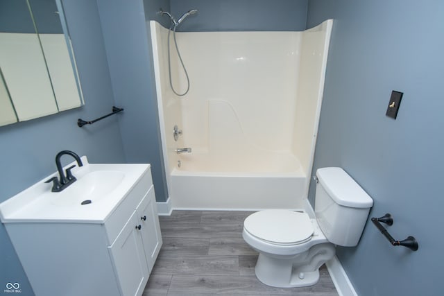 full bathroom featuring vanity, toilet, wood-type flooring, and shower / tub combination