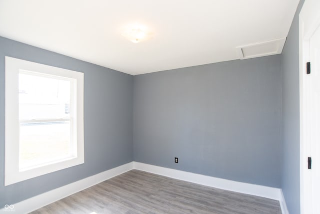 empty room with hardwood / wood-style floors