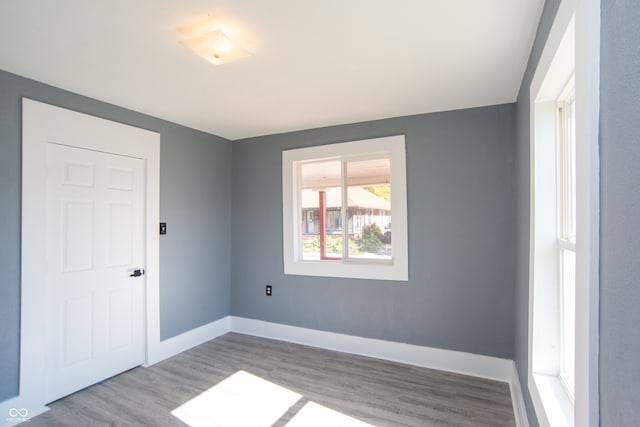 spare room featuring light wood-type flooring