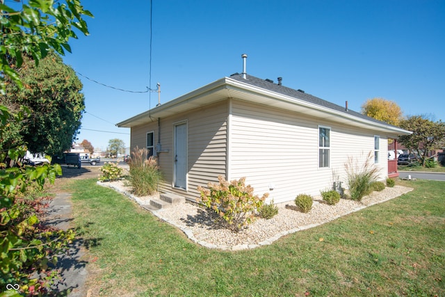 view of property exterior featuring a yard