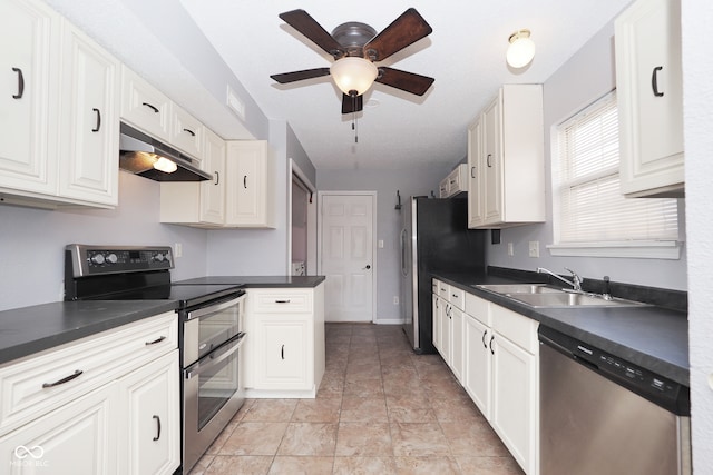 kitchen with sink, white cabinetry, stainless steel appliances, and ceiling fan