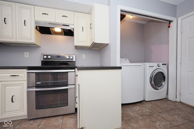 kitchen with stainless steel range oven, a textured ceiling, separate washer and dryer, and extractor fan