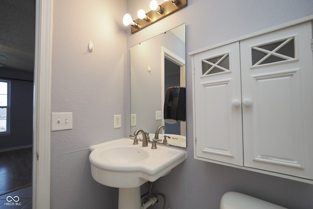 bathroom with toilet and sink