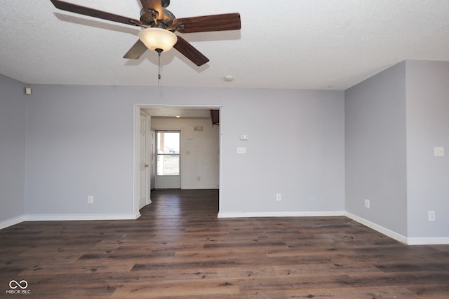 spare room with dark wood-type flooring, ceiling fan, and a textured ceiling