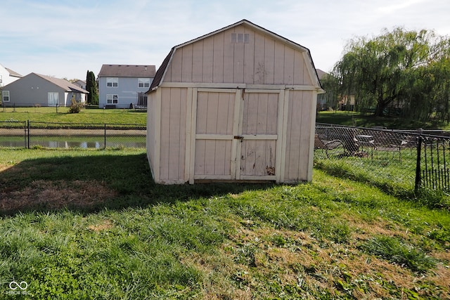 view of outdoor structure with a lawn