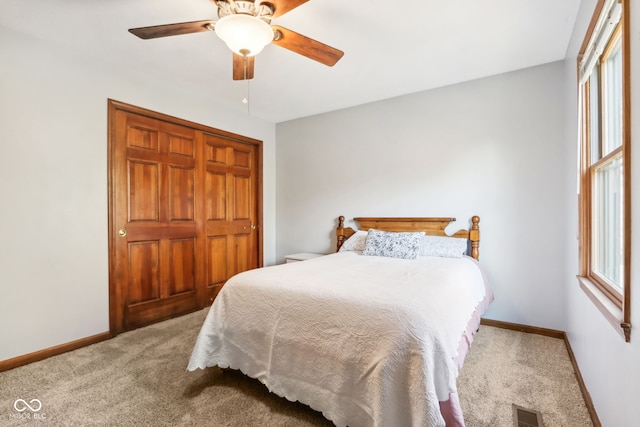 bedroom featuring a closet, carpet flooring, and ceiling fan