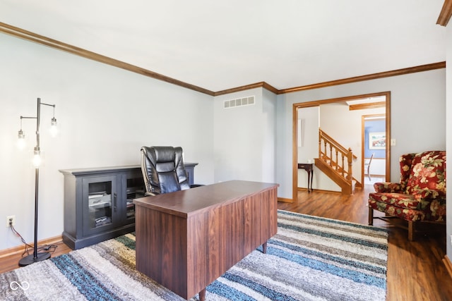 office with ornamental molding and dark hardwood / wood-style floors