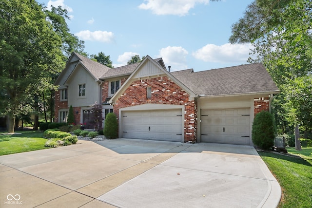 view of property featuring a front yard and a garage