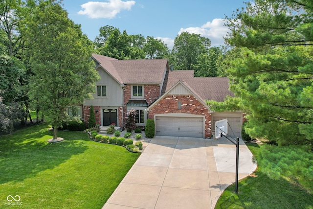 view of front of house with a garage and a front lawn