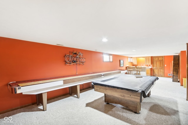 playroom with light carpet, bar, and pool table