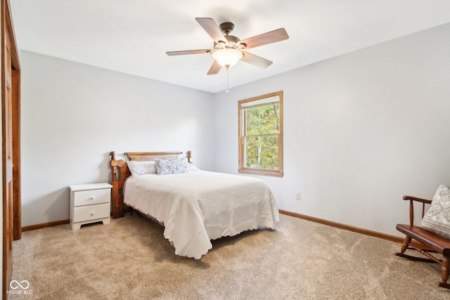 bedroom featuring ceiling fan and light colored carpet