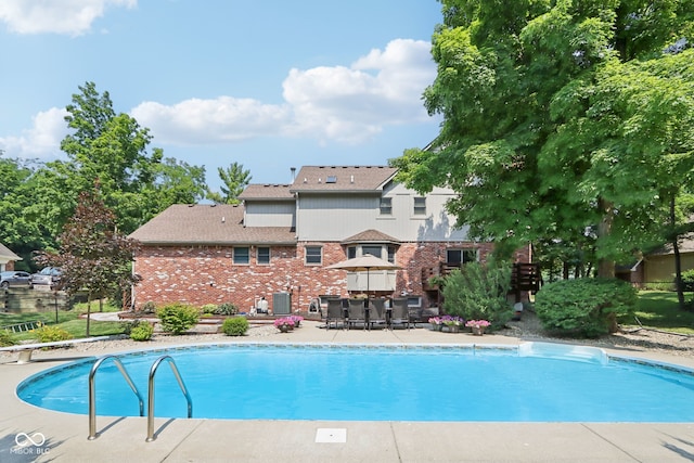 view of swimming pool with a patio