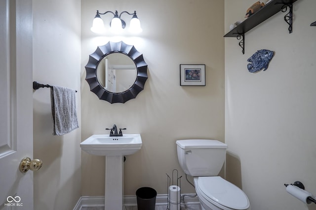 bathroom featuring sink and toilet