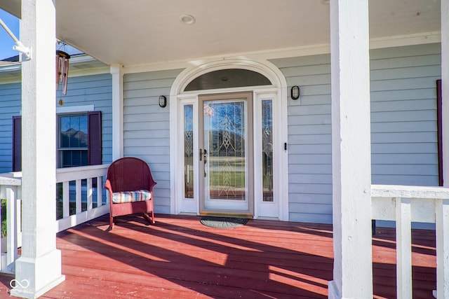 entrance to property featuring a porch