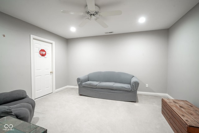 sitting room with carpet flooring and ceiling fan