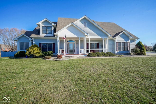 view of front of home with a porch and a front yard