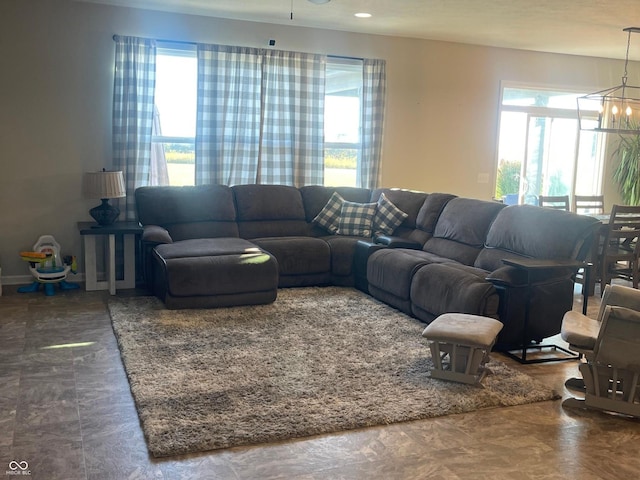 living room featuring a notable chandelier