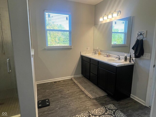 3503 W 100 N, Bargersville, IN 46106 - bathroom with wood finished floors, a shower stall, double vanity, and baseboards