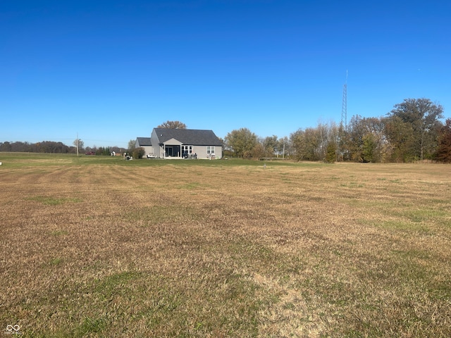 view of yard with a rural view