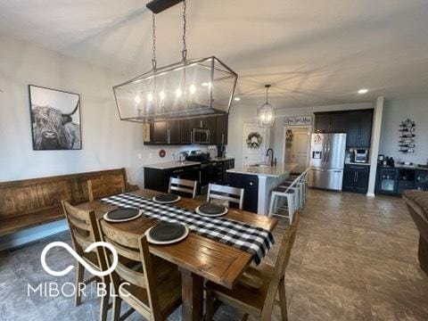 dining space with a chandelier