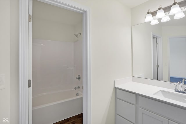 bathroom featuring vanity and shower / tub combination