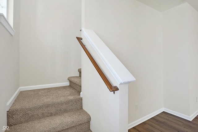 stairs with hardwood / wood-style flooring